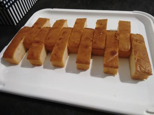 a group of breadsticks on a white plate at Nap Carta Puebla in Oviedo