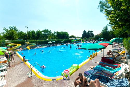 a large swimming pool with many people in it at Camping Cisano - San Vito in Bardolino