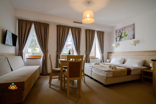 Et opholdsområde på Villa Astra - Apartments & Restaurant