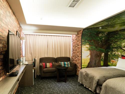Postel nebo postele na pokoji v ubytování E-House Hotel