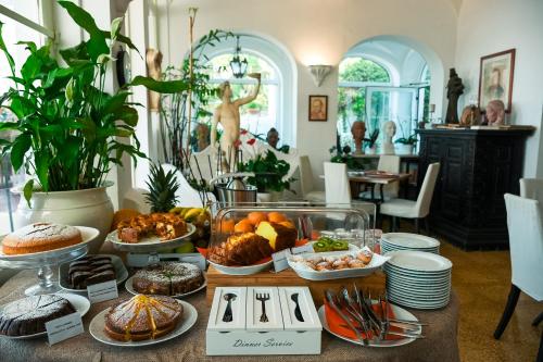 a table topped with lots of different types of food at La Reginella Capri in Capri