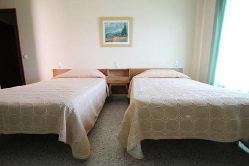 Pensio Fluvia tesisinde bir odada yatak veya yataklar