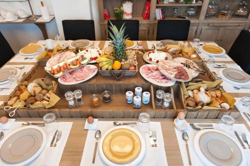 a long table with a buffet of food on it at Al Pescatore - B&B in Bari