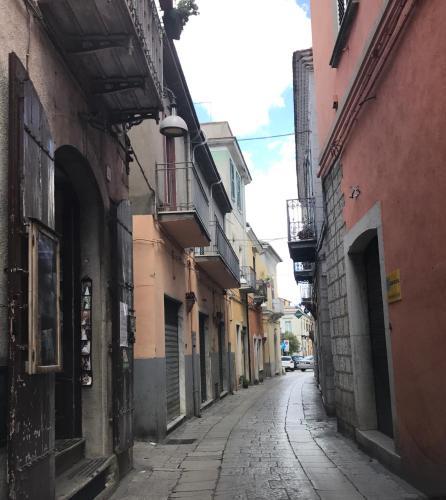 an empty alley with buildings and a street at Ca' del Borgo in Venosa