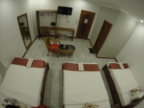 an overhead view of a room with a bed and a table at Happy​​ Family Guesthouse in Kampot