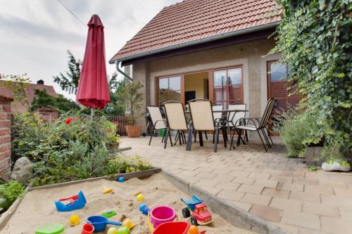 a backyard with a table and chairs and a sandbox at Amazing 5 bedroom house KRUMLOV 82 - 4 min walk to main square in Český Krumlov