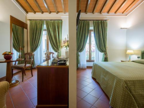 Ένα ή περισσότερα κρεβάτια σε δωμάτιο στο Hotel Panama