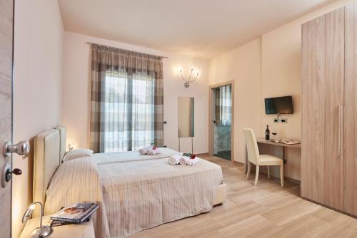 a bedroom with a bed with two stuffed animals on it at Domus Il Palio in Siena