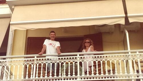 a man and a woman standing on a balcony at Marialena Pension in Iraion
