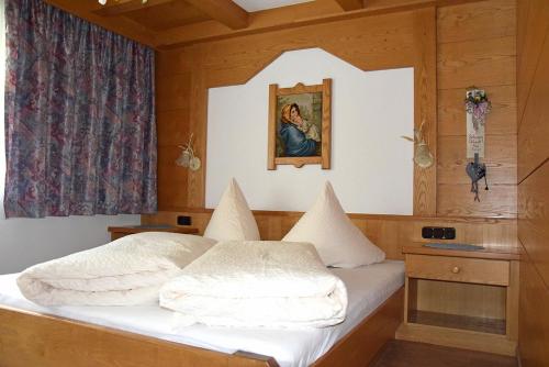 Postel nebo postele na pokoji v ubytování Ferienwohnung Tux