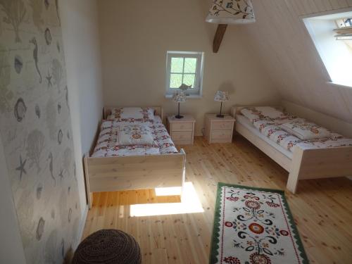 a bedroom with two beds and a window at Weitblick in Hasselberg