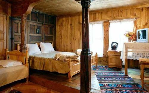 Tempat tidur dalam kamar di Guest House Polah Ot Minaloto