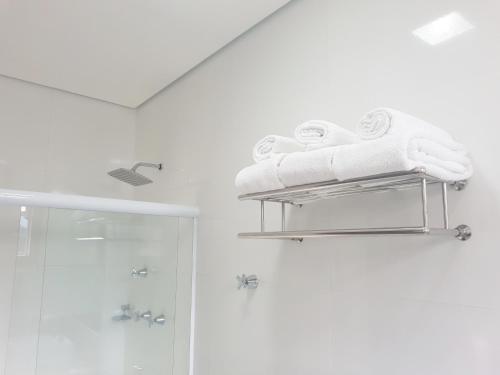 a towel rack in a bathroom with a shower at Mirante Hotel in Ouro Preto