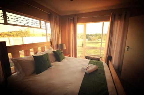Ένα ή περισσότερα κρεβάτια σε δωμάτιο στο Nukakamma River Guesthouse