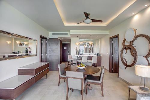 a dining room and kitchen with a table and chairs at Royalton Negril, An Autograph Collection All-Inclusive Resort in Negril