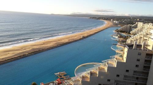 an aerial view of a beach and the ocean at San Alfonso del Mar Departamentos in Algarrobo