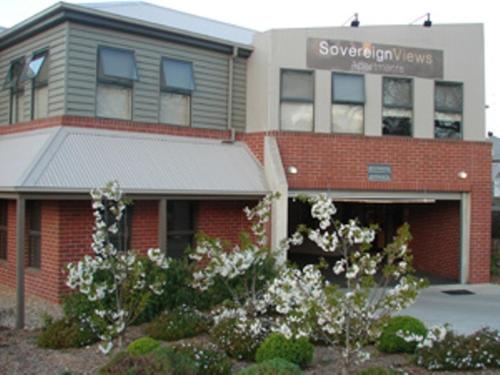 a building with a sign that reads superior gym valves at Sovereign Views Apartments in Ballarat