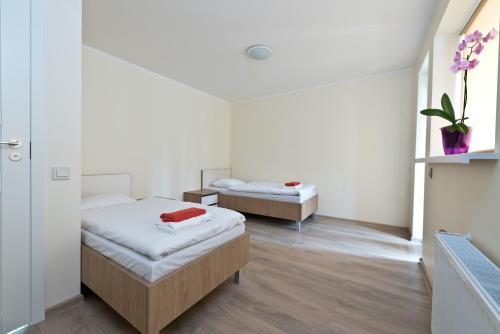 Postel nebo postele na pokoji v ubytování Bella Jūrmala ApartHotel