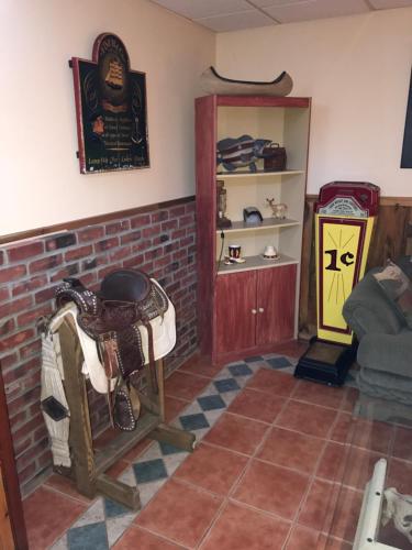 a living room with a couch and a table and a shelf at Clover Hill Farm & Country Inn in Williamstown