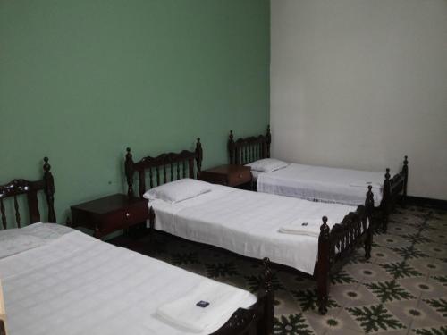 Postel nebo postele na pokoji v ubytování Hotel Villa de las Palmas