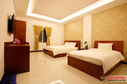 Katil atau katil-katil dalam bilik di Red Hotel