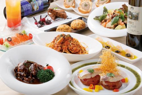 a table full of plates of food on a table at Kurume Hotel Esprit in Kurume