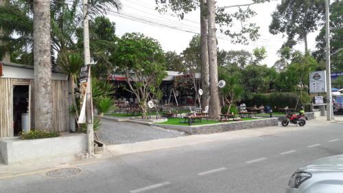 a motorcycle parked on the side of a street at Asia's Beach Apartments in Sattahip