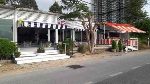 a restaurant on the side of a street at Asia's Beach Apartments in Sattahip