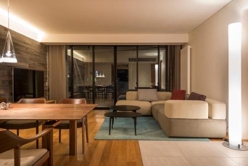 a living room with a couch and a table at Kozue in Kutchan