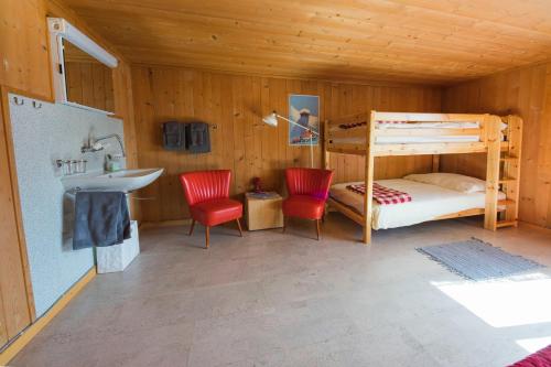 Voodi või voodid majutusasutuse Gästehaus Alpina in Fanas toas