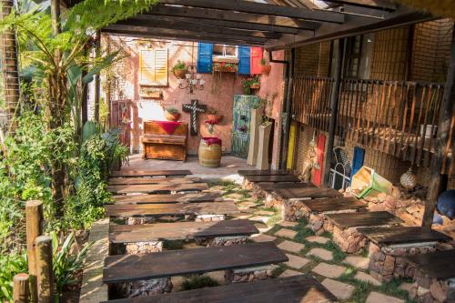 a walkway with wooden planks on the side of a building at Big 5 Guest House Witbank in Witbank