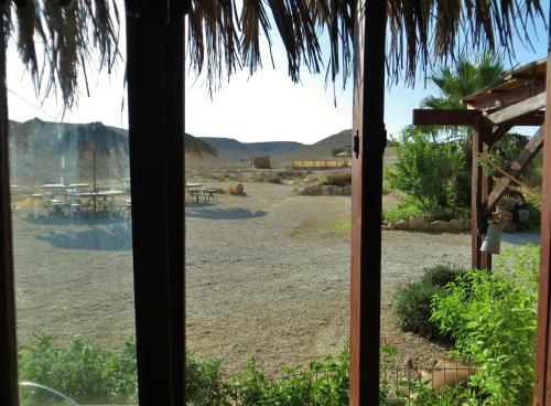 a view of a beach from a window at Succah in the Desert in Mitzpe Ramon