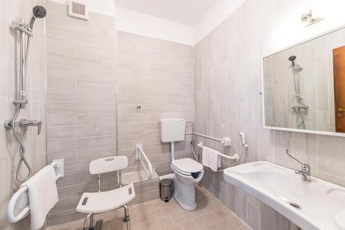 a bathroom with a toilet and a sink at Residence iL Lago in Cluj-Napoca