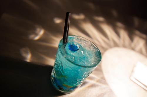 a blue glass object with a stick in it at The Lodge Sporthotel - Golfclub Eppan in Appiano sulla Strada del Vino