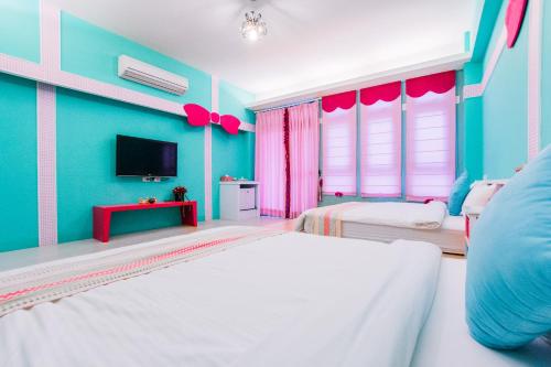 Ένα ή περισσότερα κρεβάτια σε δωμάτιο στο Capri Homestay