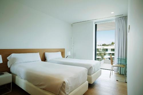 Postel nebo postele na pokoji v ubytování Holiday Rentals at Camiral, a Quinta do Lago Resort