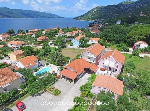 an aerial view of a house near the water at Holiday Resort Balota in Viganj