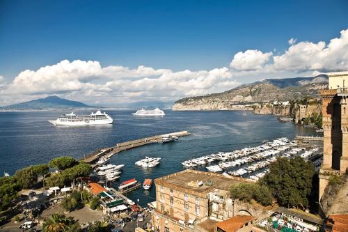 two boats are docked in a harbor on the water at Surriento Suites in Sorrento
