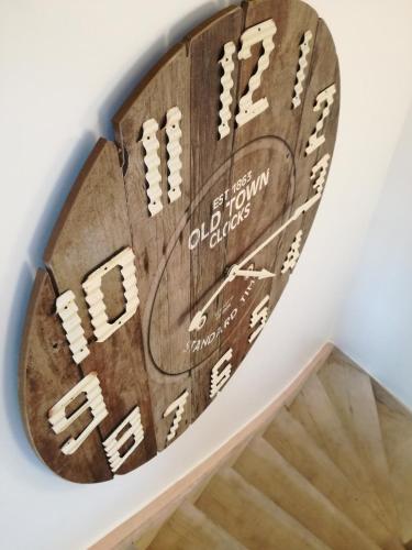 a wooden scoreboard hanging on a wall in a room at The Front Door N12 in Ypres