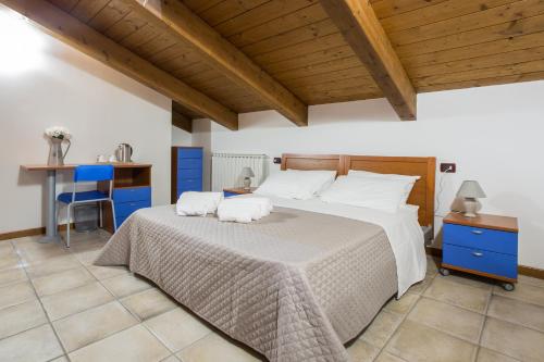 Postel nebo postele na pokoji v ubytování Le Campane di Assisi