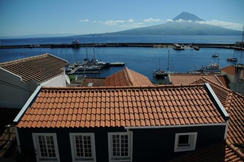 a view of a harbor with boats in the water at Casa BuonVento in Horta