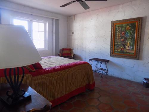 Ein Bett oder Betten in einem Zimmer der Unterkunft Poco Cielo Hotel