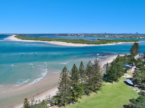 
a beach with a large body of water at Joanne Apartments in Caloundra
