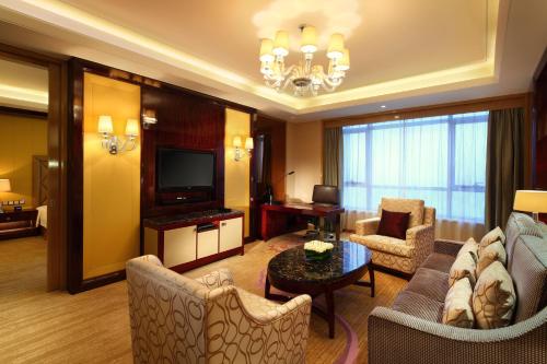 Ein Sitzbereich in der Unterkunft Wanda Realm Taizhou