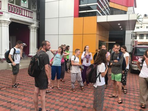 a group of people standing outside of a building at Palm Rivera Kochi in Cochin