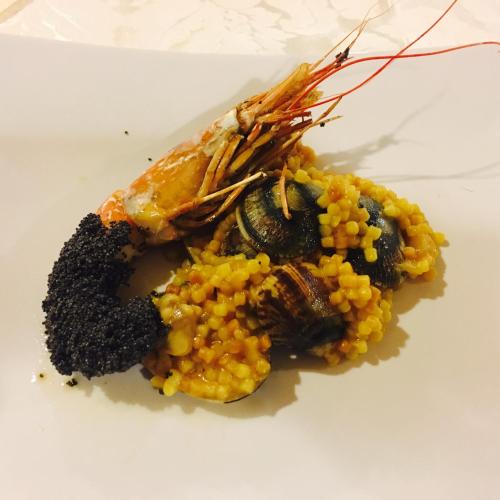 a plate of food with corn on a white plate at Atlantis Palace Hotel in Mascali