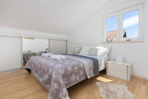 Posteľ alebo postele v izbe v ubytovaní Apartments Luka
