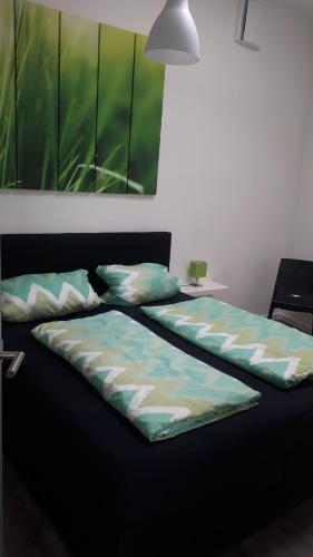 a bed with two pillows on top of it at ADAC Campingplatz in Möhnesee