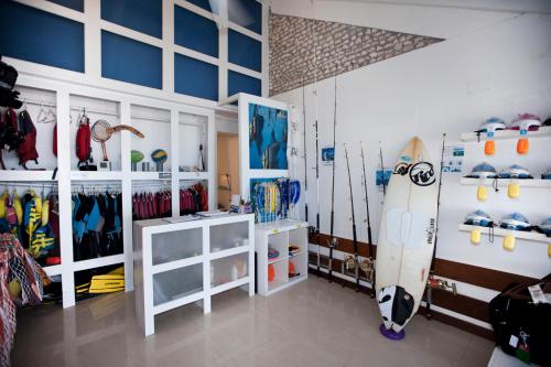 a room with skis and snowboards on display at Diamonds Thudufushi Maldives Resort & Spa in Thundufushi