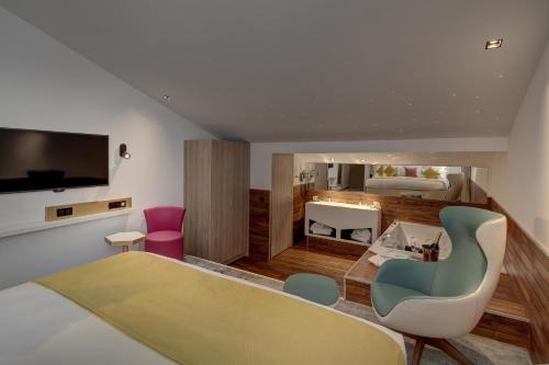 Μια τηλεόραση ή/και κέντρο ψυχαγωγίας στο Best Western Plus Comedie Saint Roch